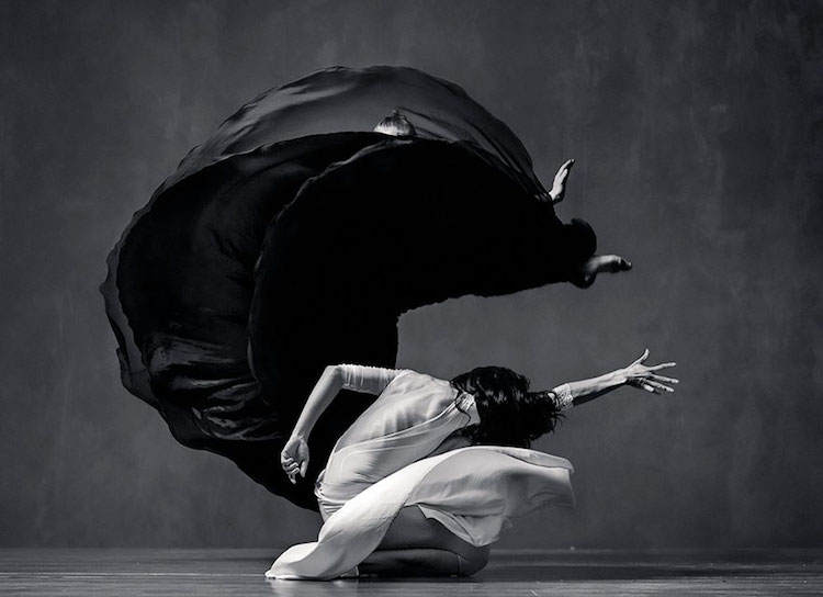 Dancers In Corporeal Movement Against Flowing Dresses