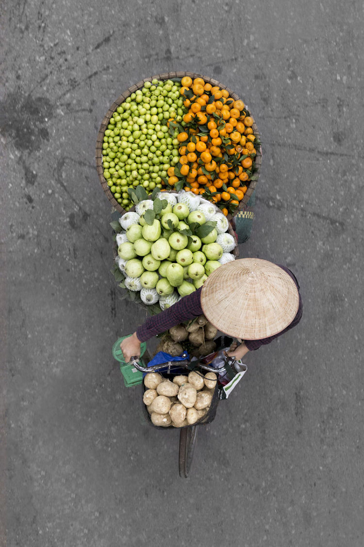 Fruit Vendor In Hanoi Embodies Symmetry And Color