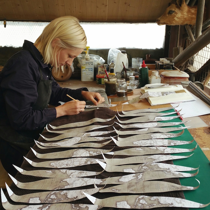Woman Handcrafting a Globe